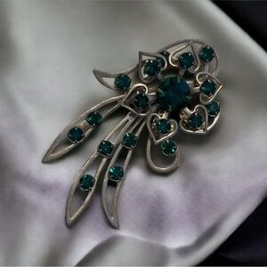 1940’s West German vintage brooch. Emerald glass stones.